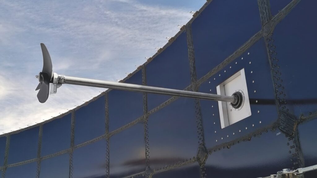 Biogas digester stirrer installed on the exterior of a large digester.